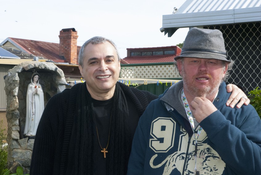 Br Alan and long-term resident at the Emmaus Community, Michael Smith, stand beside the grotto to the Virgin Mary in one of the many gardens at the Emmaus Community, Queens Park.