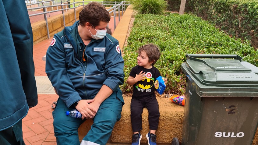 Micah with Ambo at Brown Park Evacuation Centre_web